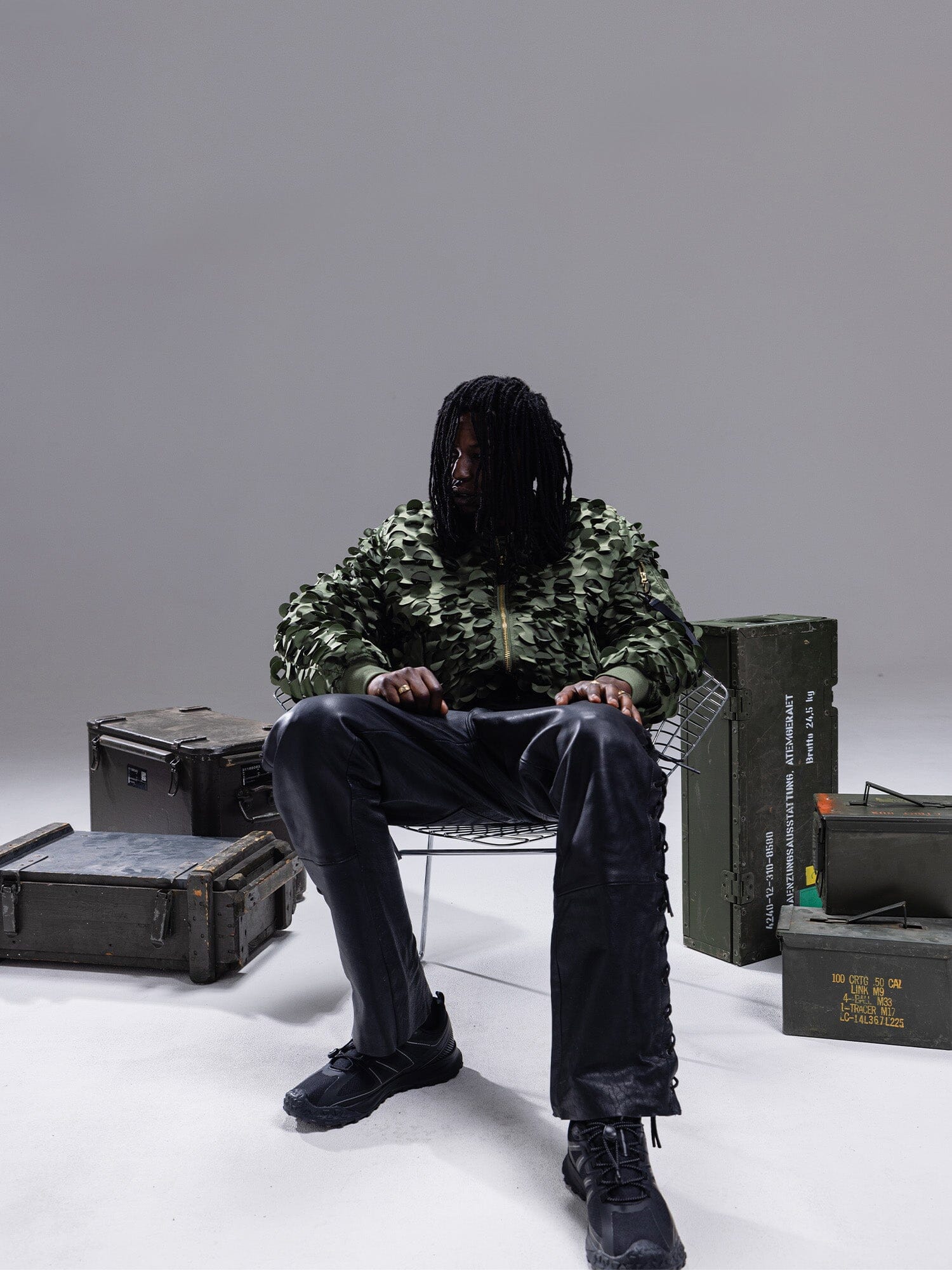 Alpha Industries MA-1 ULCANS Flight Jacket, black pants; jacket features include military-inspired design and front zip closure.