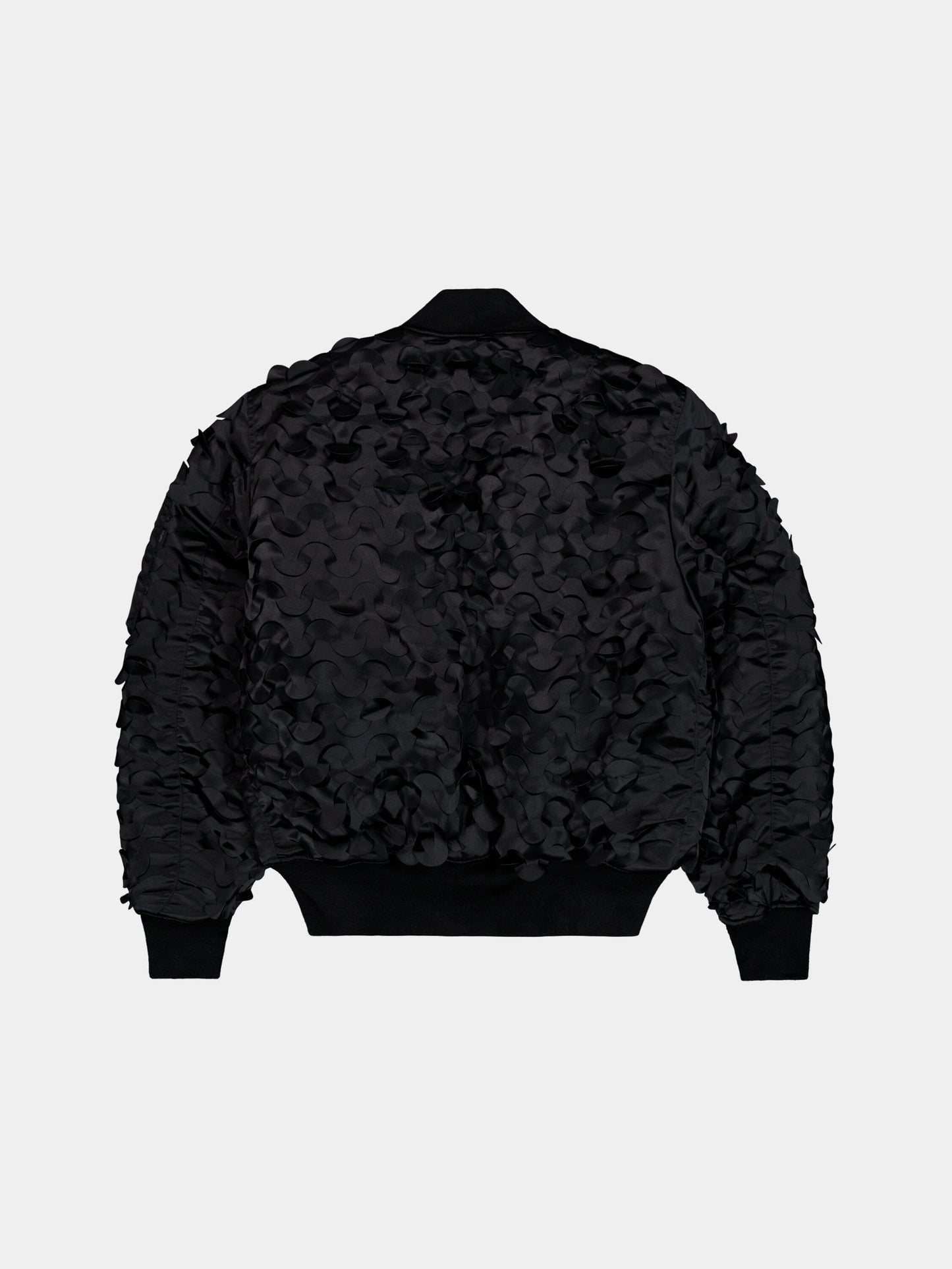 Alpha Industries MA-1 ULCANS Flight Jacket in black with textured wavy detailing on back and sleeves.