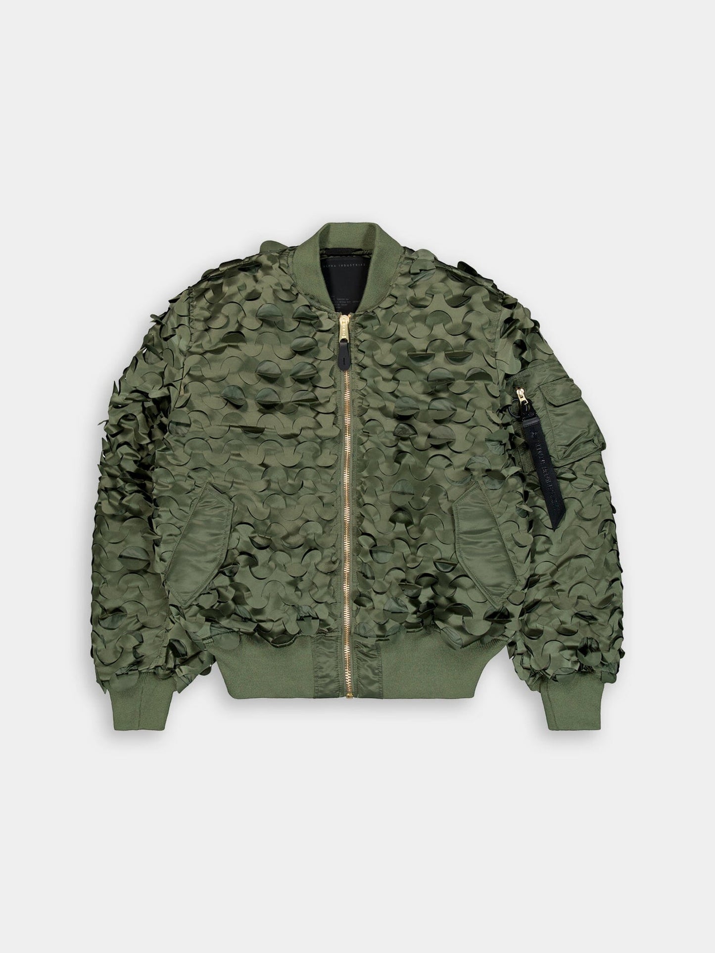 Alpha Industries MA-1 ULCANS Flight Jacket, sage, textured camo pattern, ribbed cuffs and hem, front zipper, zippered sleeve pocket with black tag.