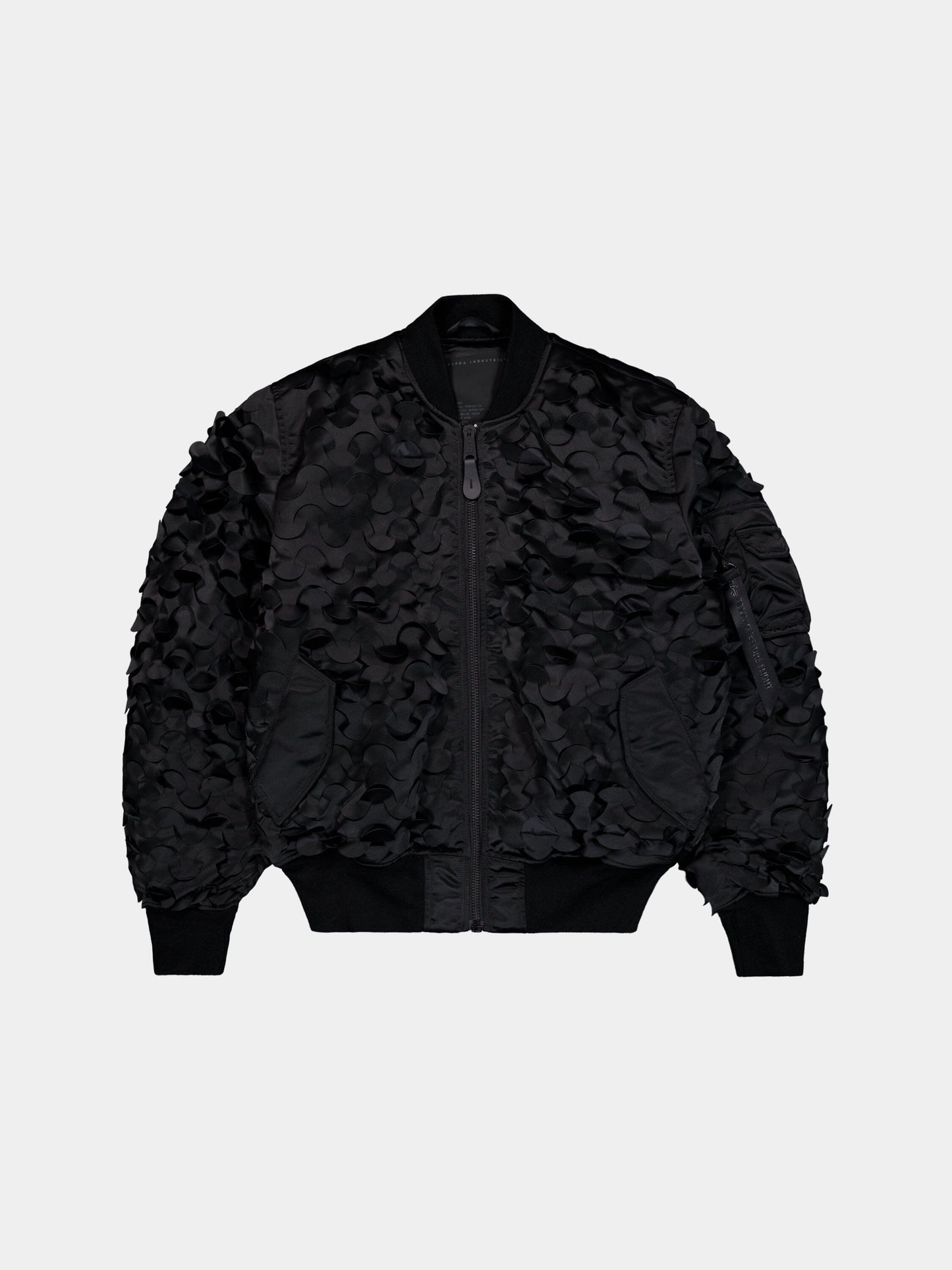 MA-1 ULCANS Flight Jacket by Alpha Industries in black with floral textured pattern, central zipper, and ribbed cuffs, collar, hem.