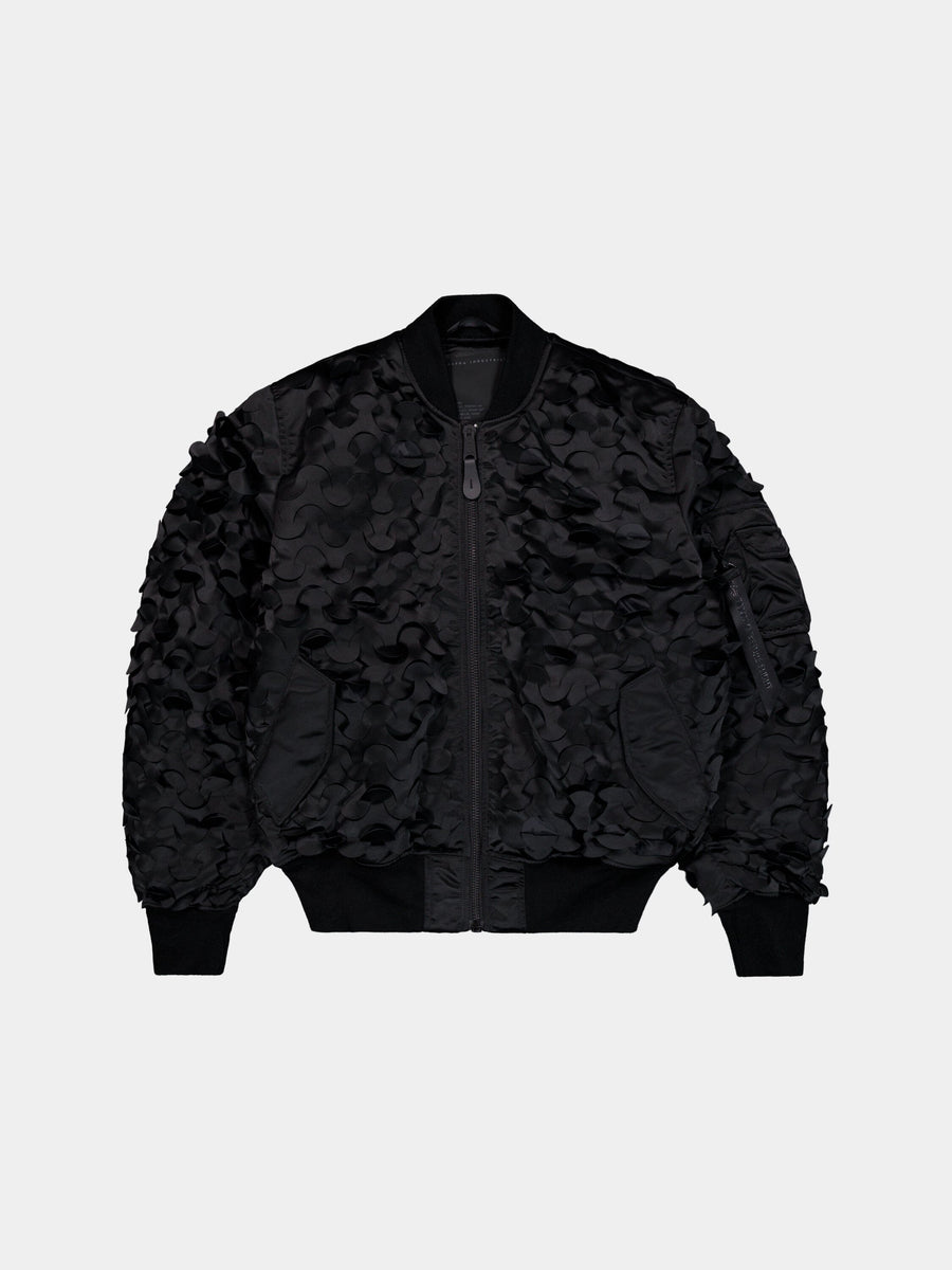 MA-1 ULCANS Flight Jacket by Alpha Industries in black with floral textured pattern, central zipper, and ribbed cuffs, collar, hem.
