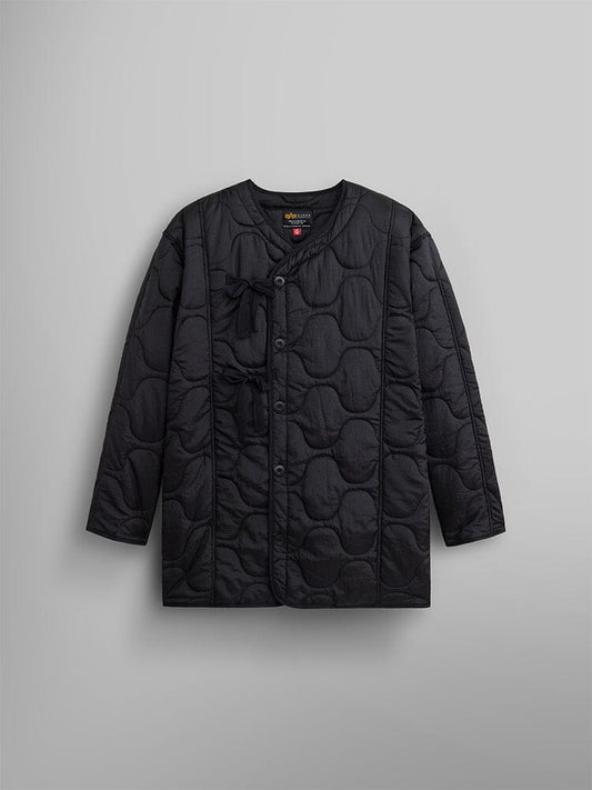 Women's Mixed Media Quilted Long Liner by Alpha Industries showcases a black hue with onion quilting that adds texture and a nylon liner for supreme comfort.
