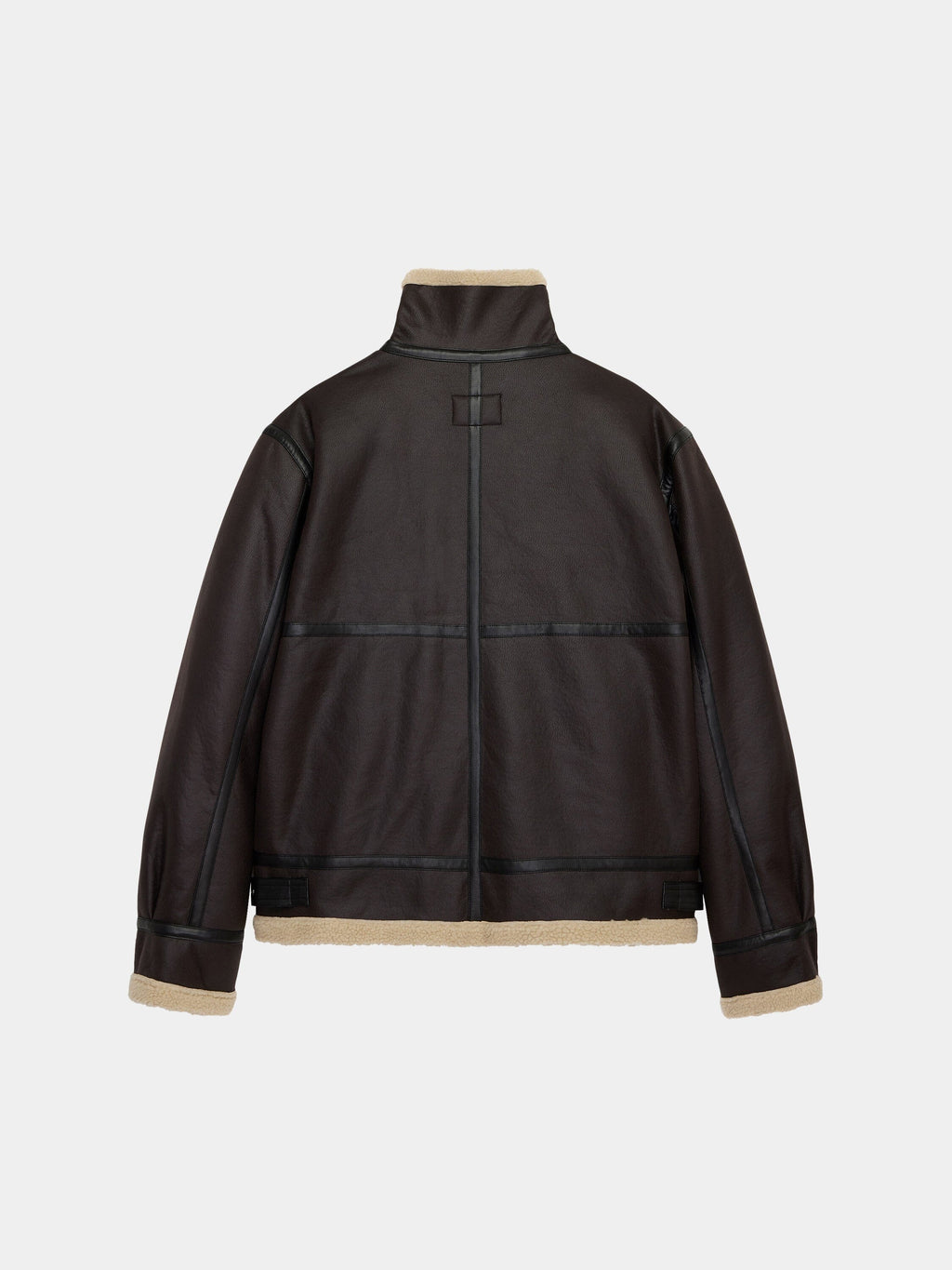 Alpha Industries Mouton B-3 jacket with black seam detailing, high collar, and tan shearling trim.