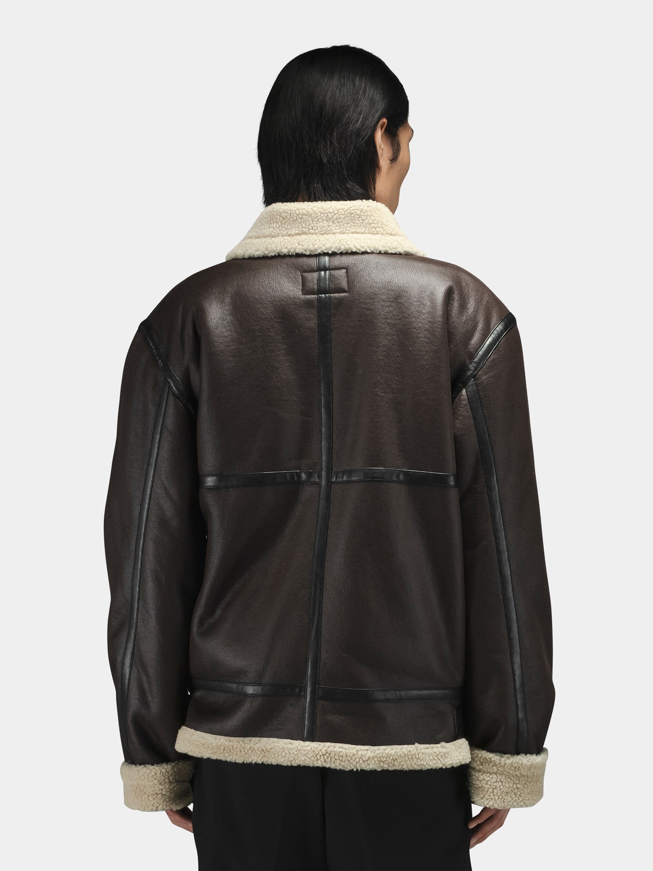Alpha Industries Mouton B-3 jacket with dark brown exterior and cream-colored fleece collar and trim.