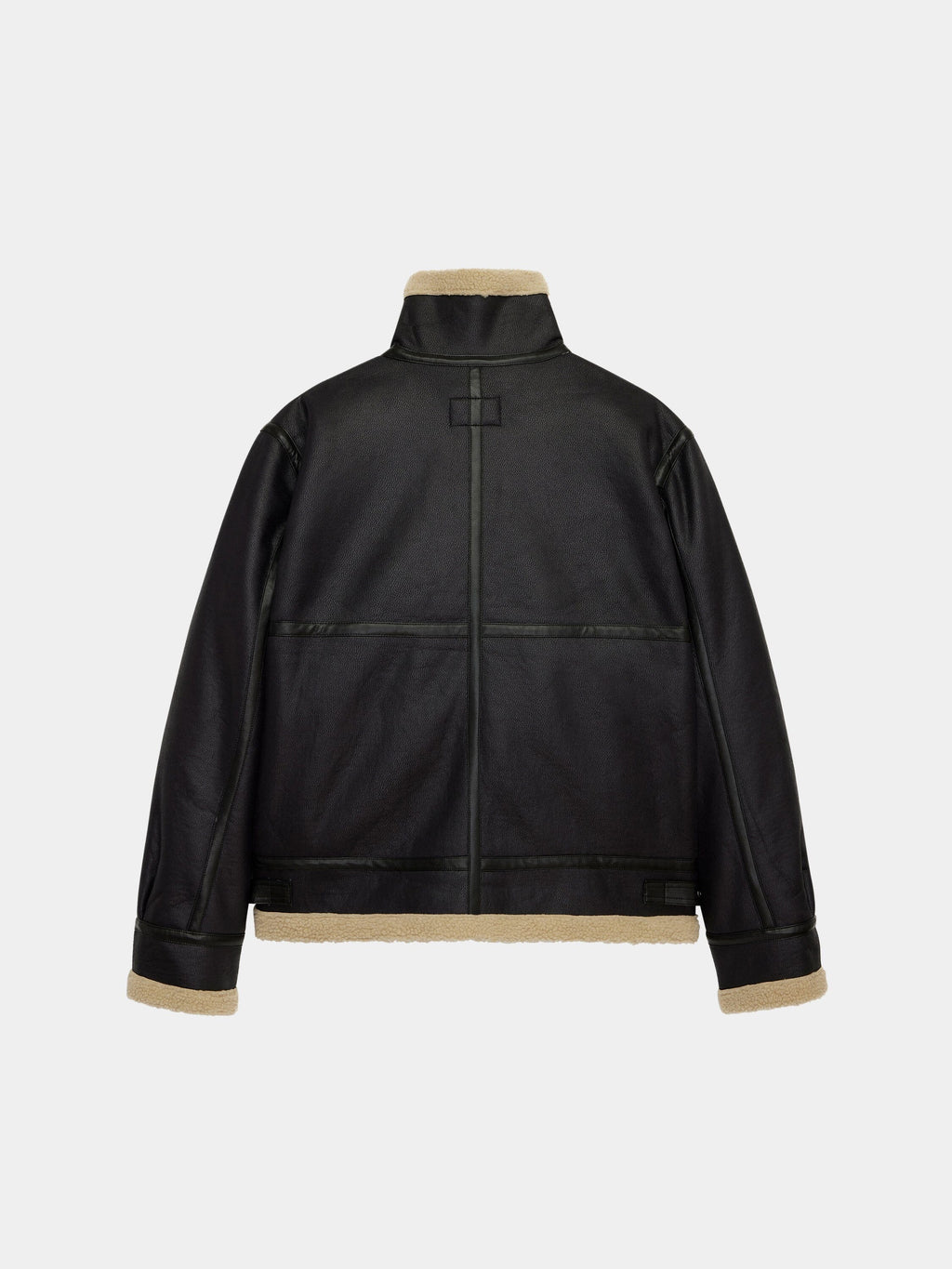 Alpha Industries Mouton B-3 jacket in black faux leather with beige shearling lining and trim.