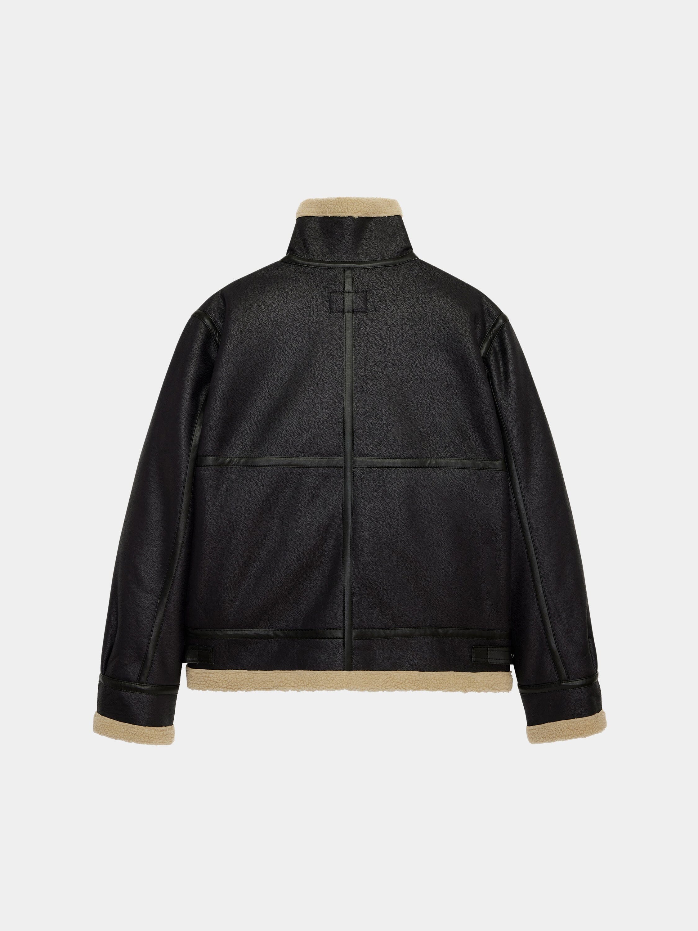 Alpha Industries Mouton B-3 jacket in black faux leather with beige shearling lining and trim.