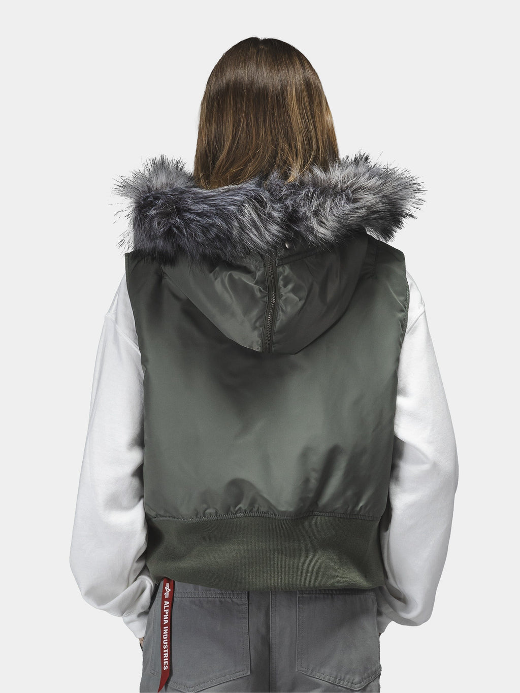 Alpha Industries N-2B Vest Womens in green with faux fur hood over white hoodie.