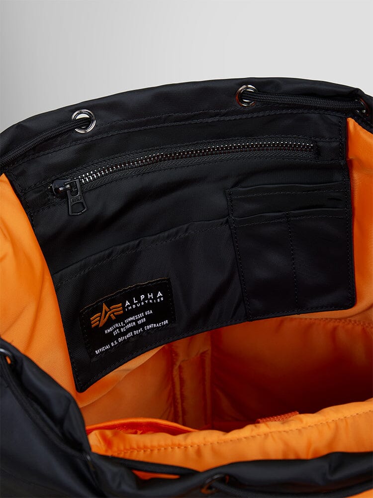 Alpha Industries Nylon Backpack, black, orange lining, zippered pocket, inner compartments, laptop sleeve, interior Alpha Industries label.