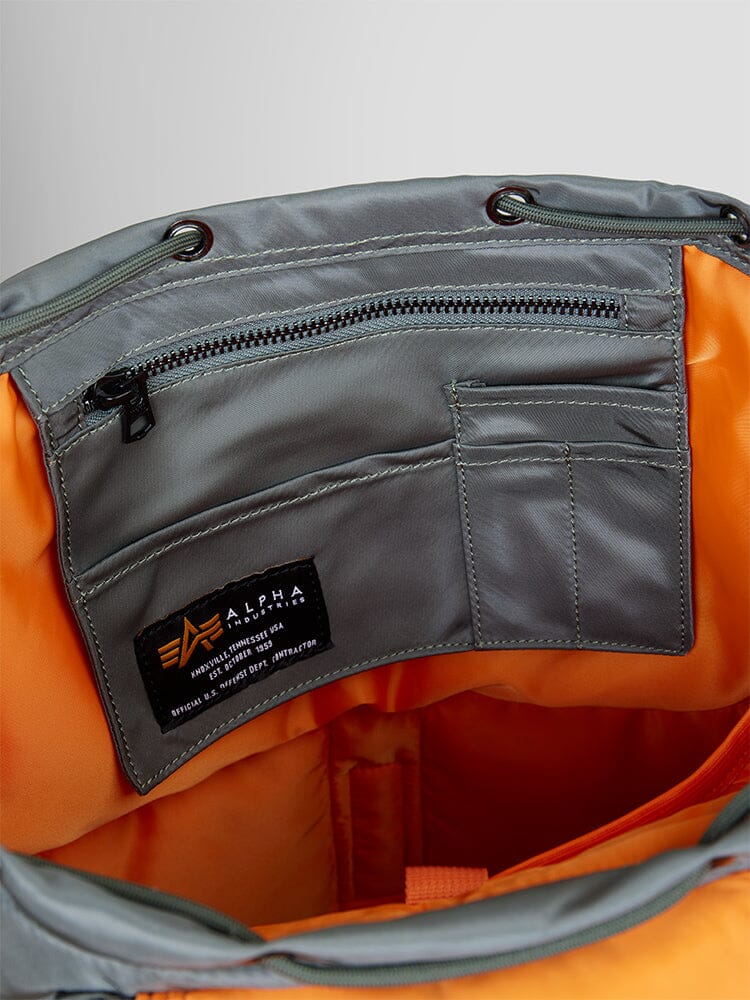 Nylon Backpack by Alpha Industries, zippered pocket, card slots, laptop sleeve, black brand label.