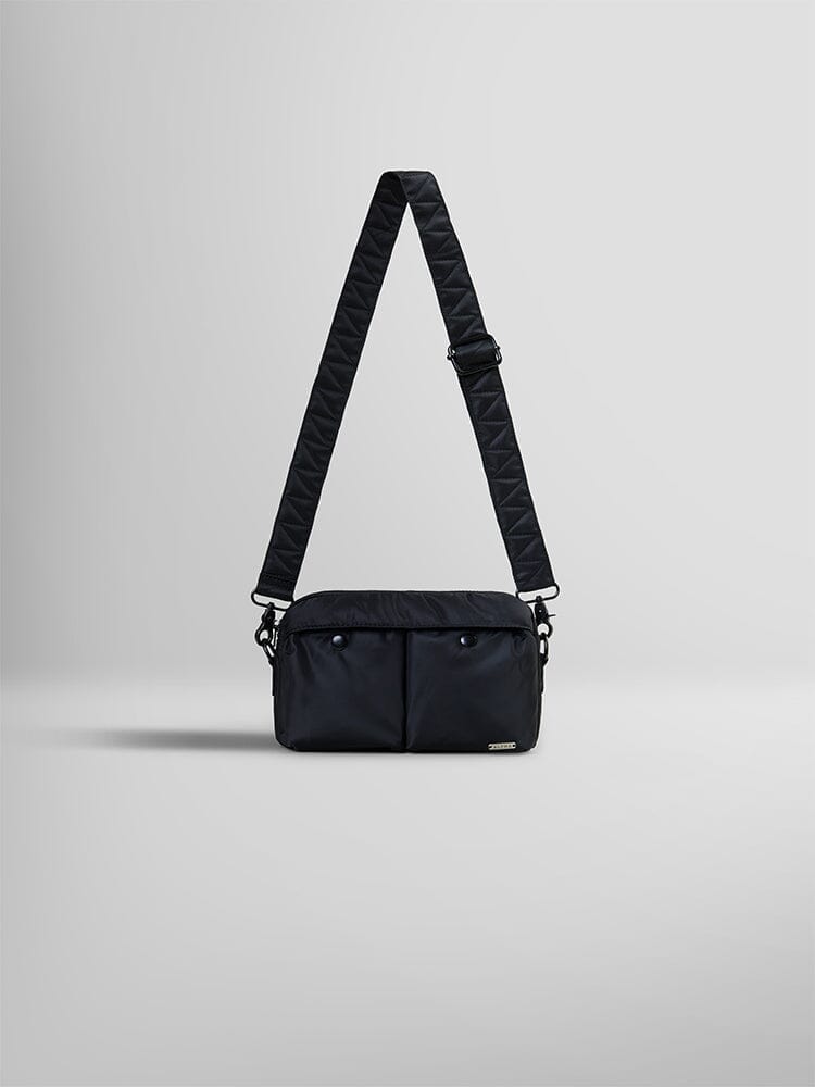 The Black Nylon Messenger Bag by Alpha Industries boasts a quilted adjustable shoulder strap and two front pockets.