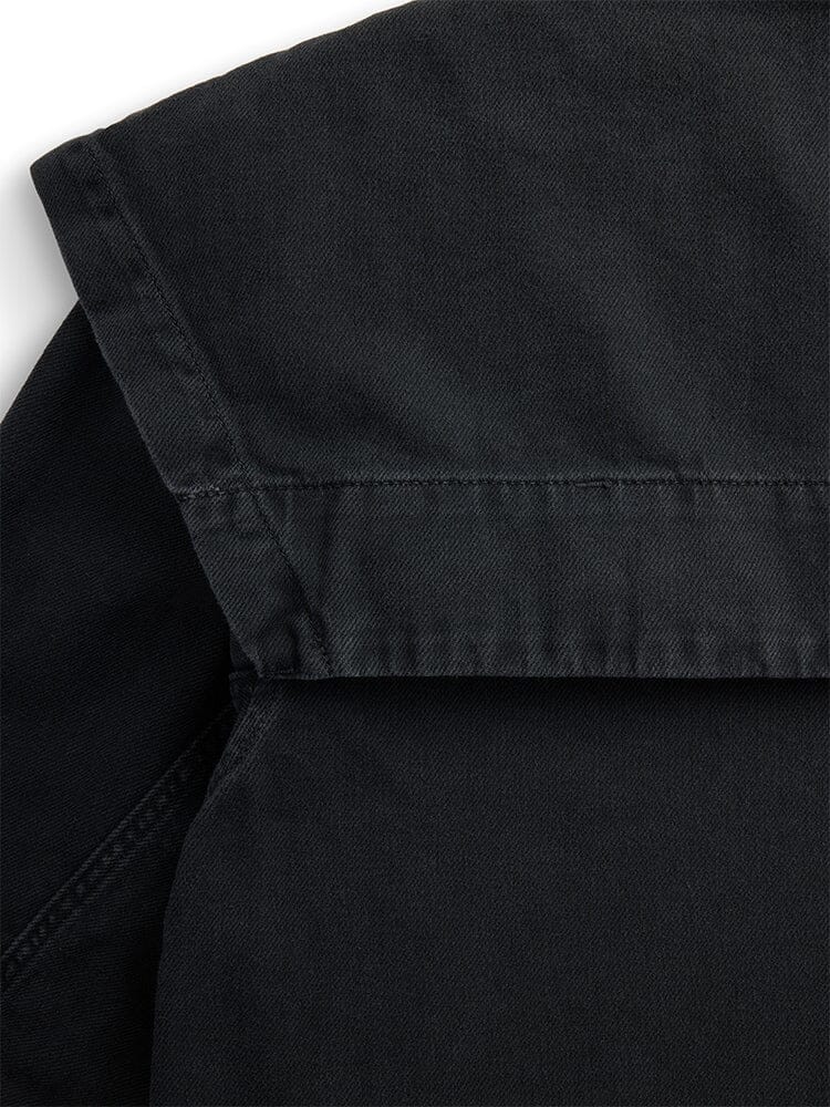 Alpha Industries Oversized Ctn Utility Jacket W in black, with shoulder seam, collar, sleeve, and visible stitching details.