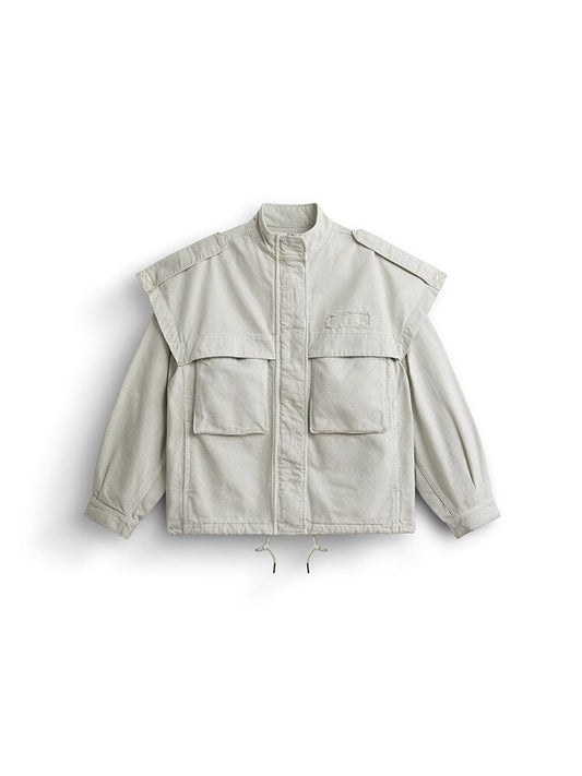 Alpha Industries Oversized Ctn Utility Jacket W In Dune White, high collar, front zipper, snap buttons, cargo pockets, shoulder epaulettes, drawstring hem.