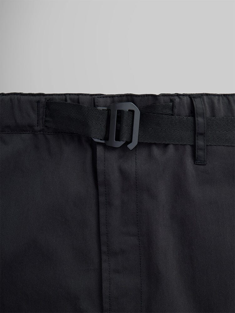 Close-up of the Oversized Tactical Pant by Alpha Industries, showcasing a plastic buckle on an adjustable strap waistband along with cargo pockets.