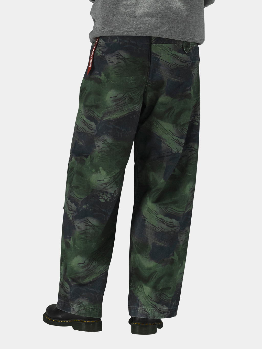 Alpha Industries Oversized Washed Pant in camo pattern with military design; black boots and gray top.