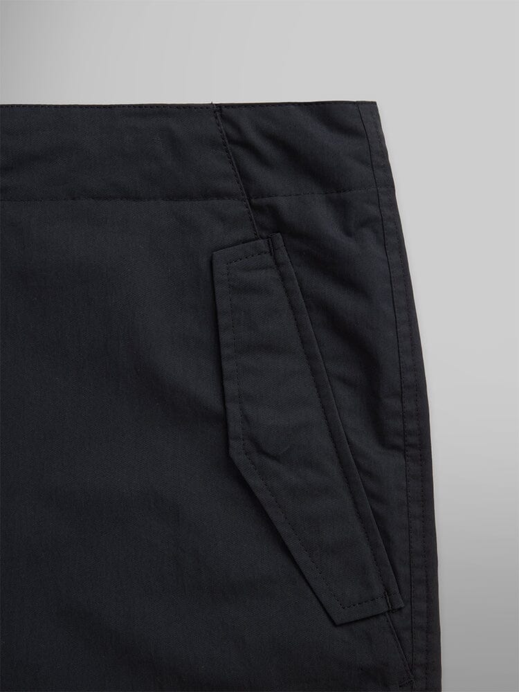 Alpha Industries Lightweight Parachute Pant, nylon/cotton blend, slanted side pocket with flap detail.