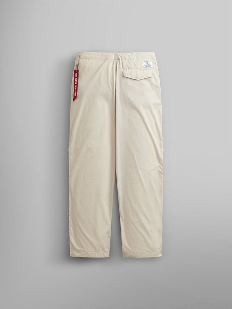 Alpha Industries Lightweight Parachute Pant, beige nylon/cotton blend, back pocket with white label and red tag.