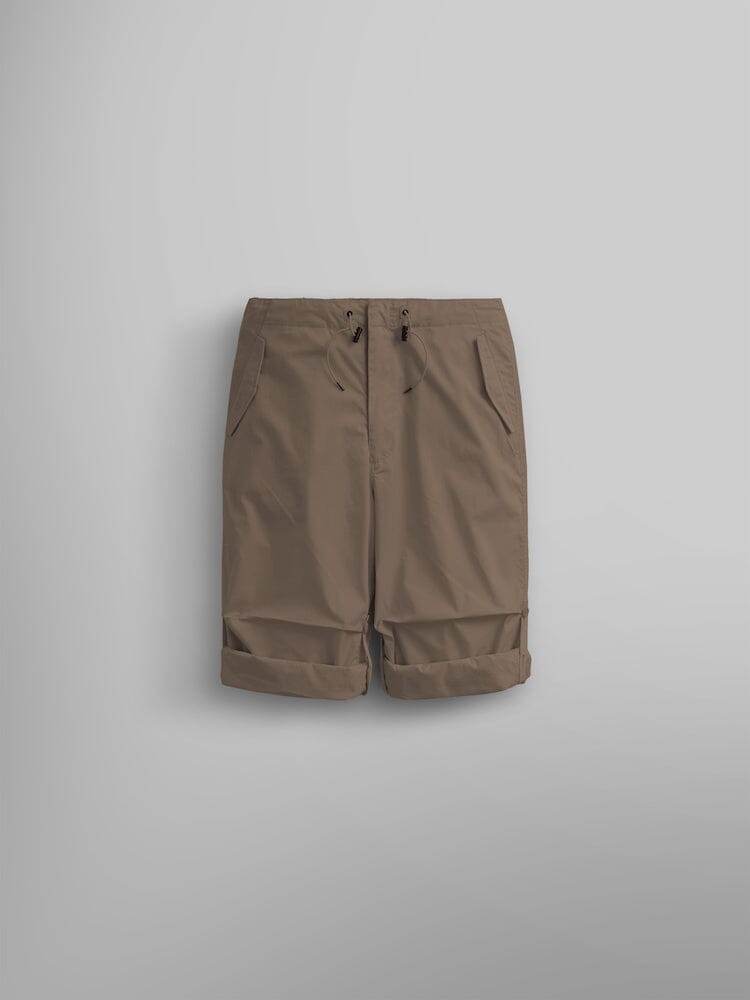 Alpha Industries Lightweight Parachute Pant in Khaki, knee-length, front pockets, drawstring waist, rolled-up hems, nylon/cotton blend.