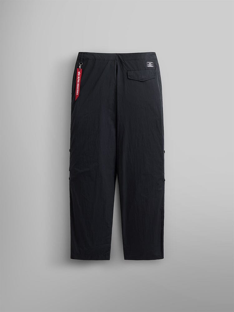 Alpha Industries Lightweight Parachute Pant, black nylon/cotton blend, straight-leg, button-flap back pocket with red tag.