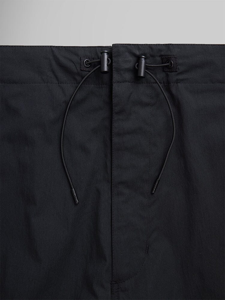 Alpha Industries Lightweight Parachute Pant, black, adjustable drawstring waistband with two plastic cord locks.