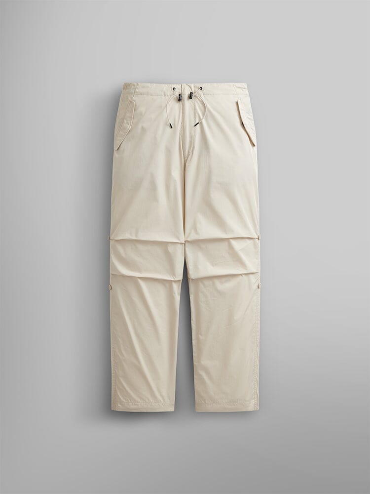Alpha Industries Lightweight Parachute Pant in Limestone, MA-1, nylon/cotton blend, zip-off legs, drawstring waist, two side pockets.