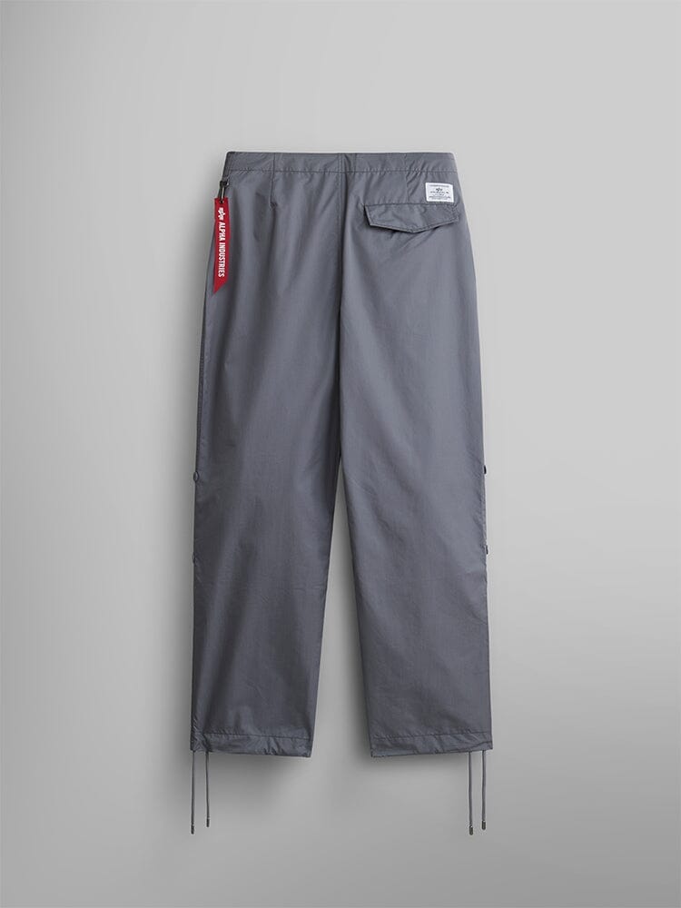 Alpha Industries Lightweight Parachute Pant, Aircraft Gray, nylon/cotton blend, straight-leg fit, drawstring hem, back pocket with white label, red fabric keychain on waistband.