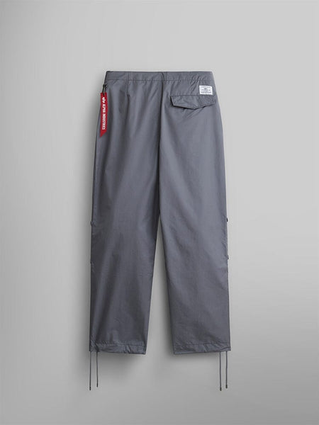 Alpha Industries Lightweight Parachute Pant, Aircraft Gray, nylon/cotton blend, straight-leg fit, drawstring hem, back pocket with white label, red fabric keychain on waistband.