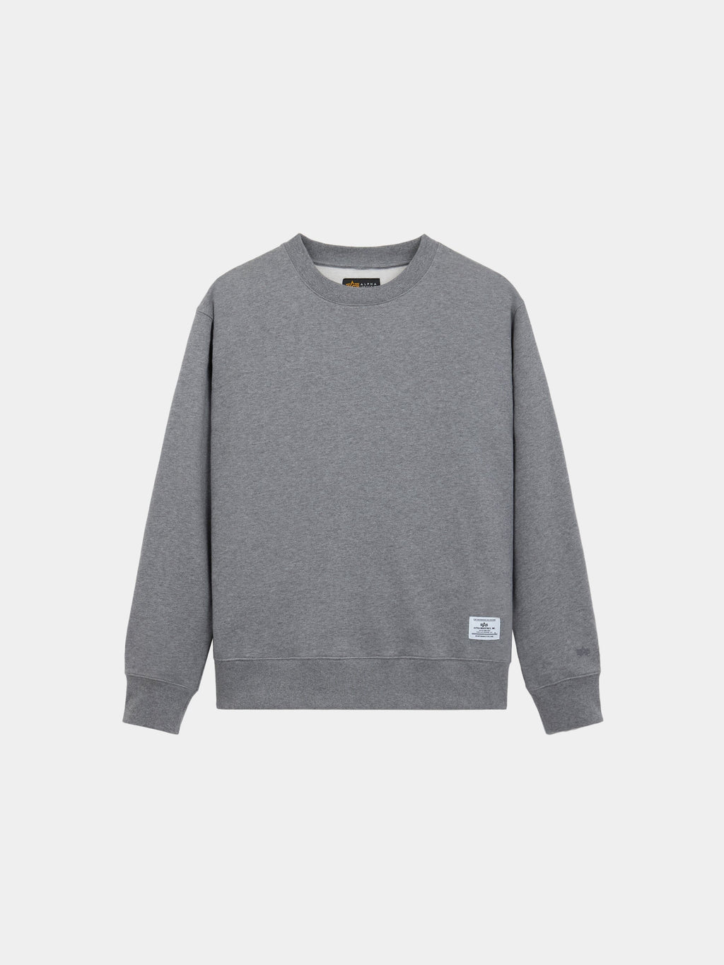 Alpha Industries Patched Crewneck, grey long-sleeve sweatshirt with small white label near hem, soft cotton-poly blend.