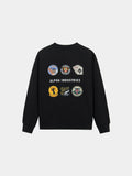 Patched Crewneck by Alpha Industries in Black, cotton-poly sweatshirt with graphic patches and Alpha Industries branding on back.
