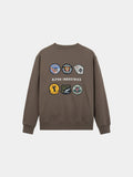 Alpha Industries Patched Crewneck in Espresso, soft cotton-poly blend, colorful embroidered patches, Alpha Industries text on back.