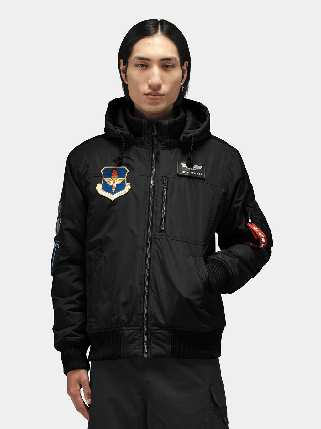 Alpha Industries Patched Hooded Rib Flight Jacket with military-inspired patches and a utility pocket.