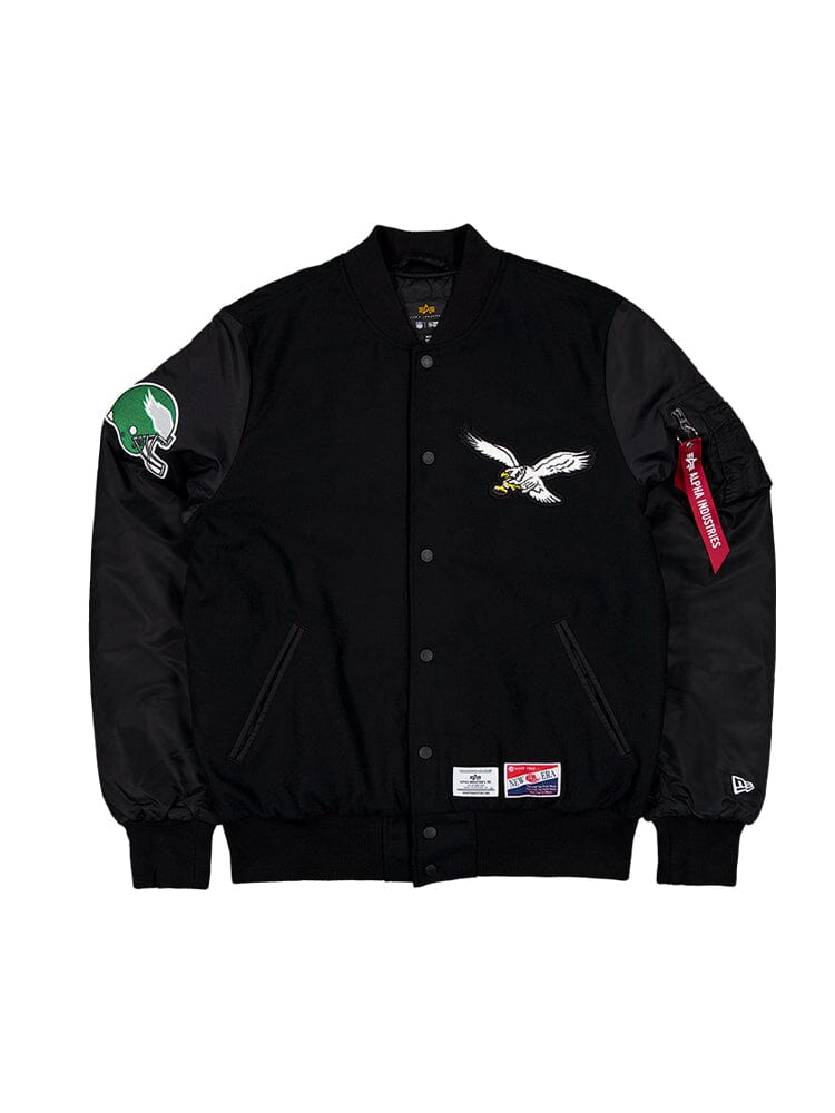 Philadelphia Eagles MA-1 Bomber Jacket by Alpha Industries, black, eagle chest patch, green football helmet sleeve patch, red Remove Before Flight tag, Alpha logo.