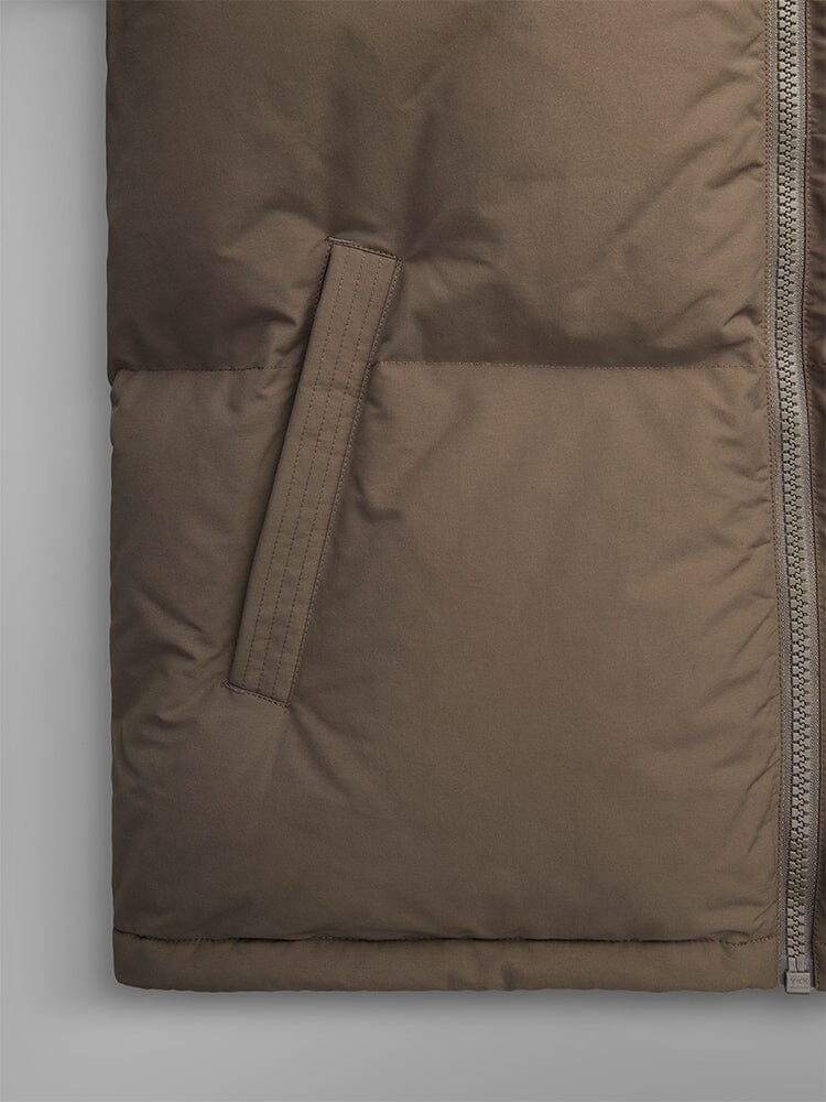 Alpha Industries Puffer Parka, brown, water-resistant, side zipper, slanted front pocket with visible stitching.