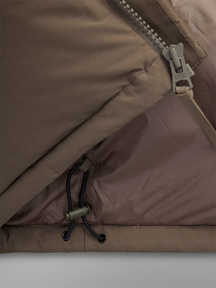 Alpha Industries Puffer Parka, khaki water-resistant fabric, zipper, elastic drawcord, plastic toggle.