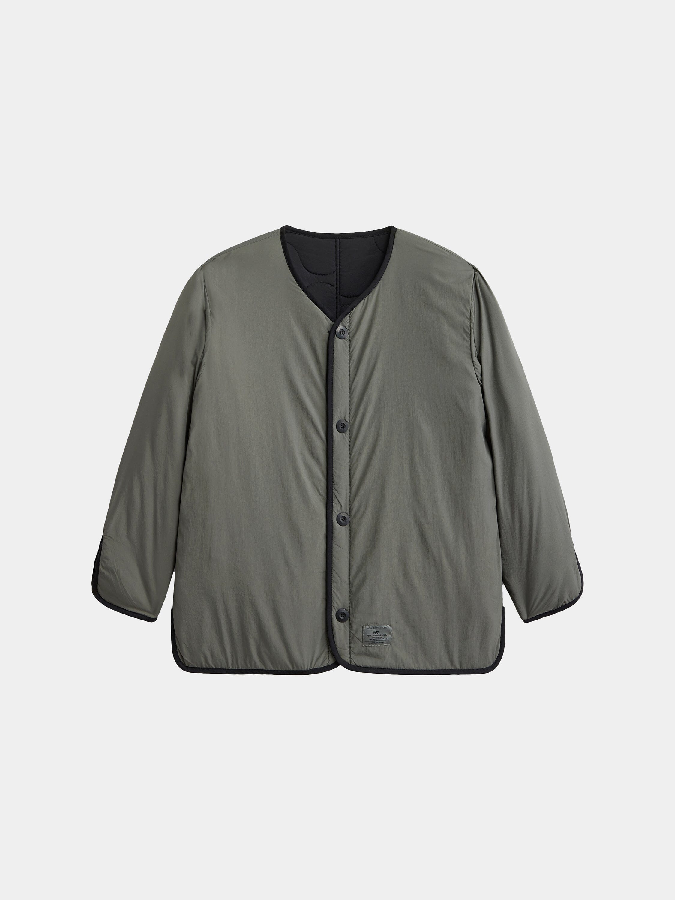 The Alpha Industries Reversible Als/92 Mod Liner Womens is a khaki green nylon ripstop jacket with black trim and a round neckline.
