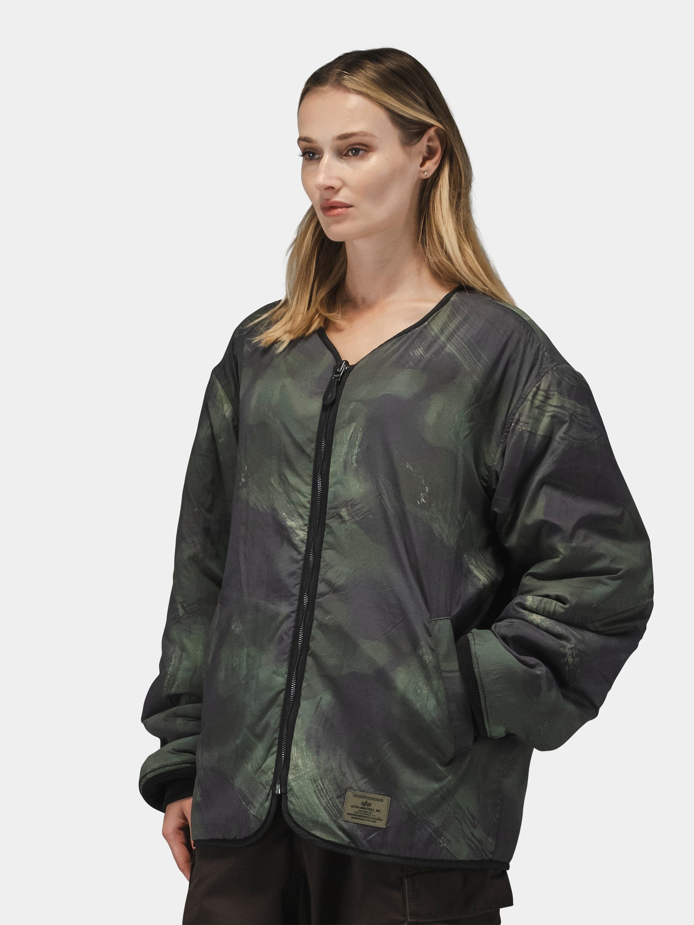 Alpha Industries Reversible M-65 Quilted Liner, camo zip-up jacket with reversible quilted liner, long sleeves, v-neck opening.