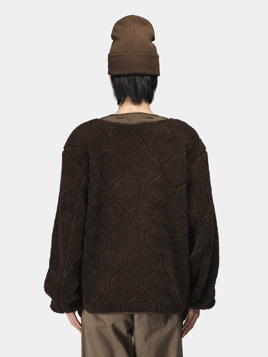 Alpha Industries Reversible M-65 Quilted Liner jacket, brown beanie, brown pants.
