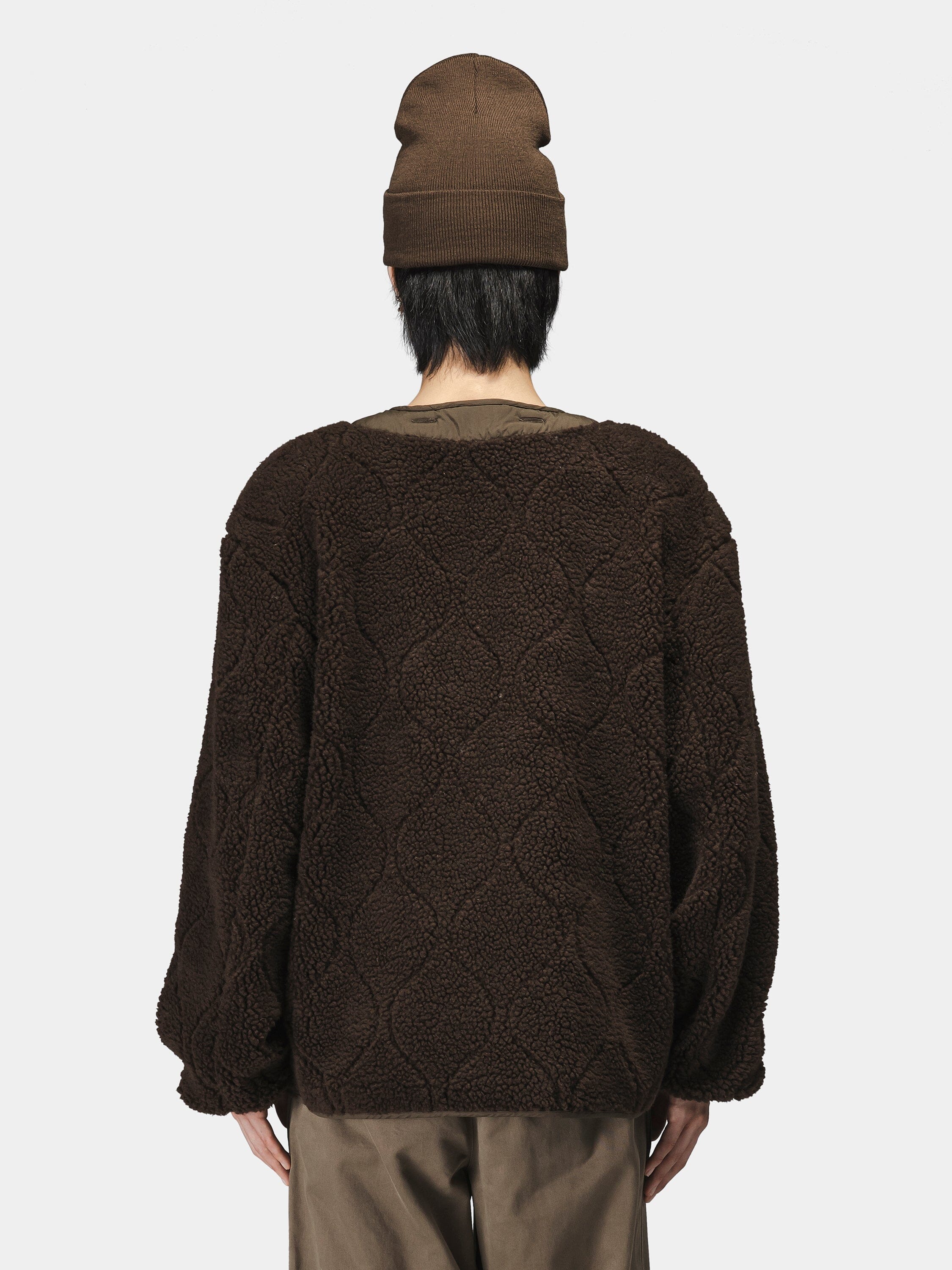 Alpha Industries Reversible M-65 Quilted Liner jacket, brown beanie, brown pants.