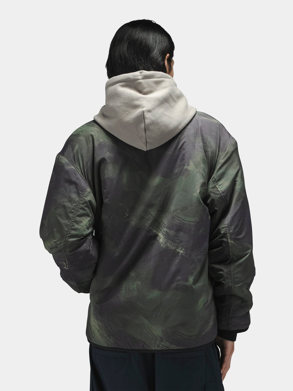 Alpha Industries Reversible M-65 Quilted Liner with reversible quilted design, light gray color, and liner material.