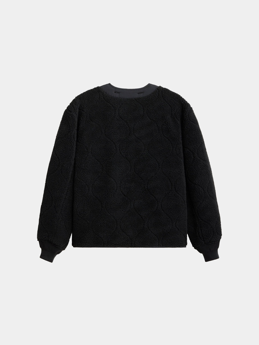 Alpha Industries Reversible M-65 Quilted Liner, black with circular quilted pattern, ribbed crew neck, cuffs, and hem.