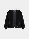 Alpha Industries Reversible M-65 Quilted Liner in black with zip front, long sleeves, quilted texture, ribbed cuffs, side pockets, plain collar.