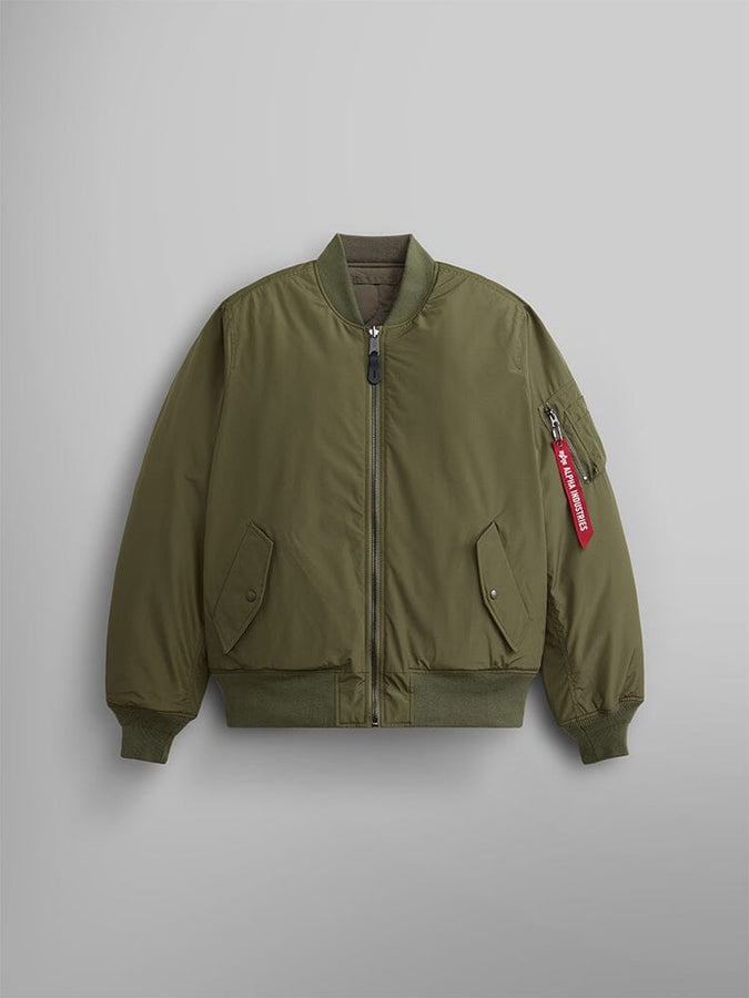 Front view of the Reversible Onion Quilted MA-1 Bomber Jacket in OG-107 green by Alpha Industries. Features a front zipper, two side pockets, and a zippered sleeve pocket with a distinctive red tag.