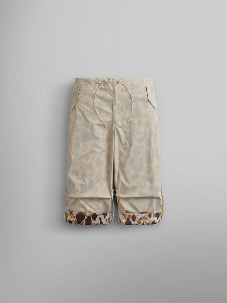 Alpha Industries Lightweight Parachute Pant in light beige with subtle ripstop camo and brown Frogskin-inspired accents at the hem.