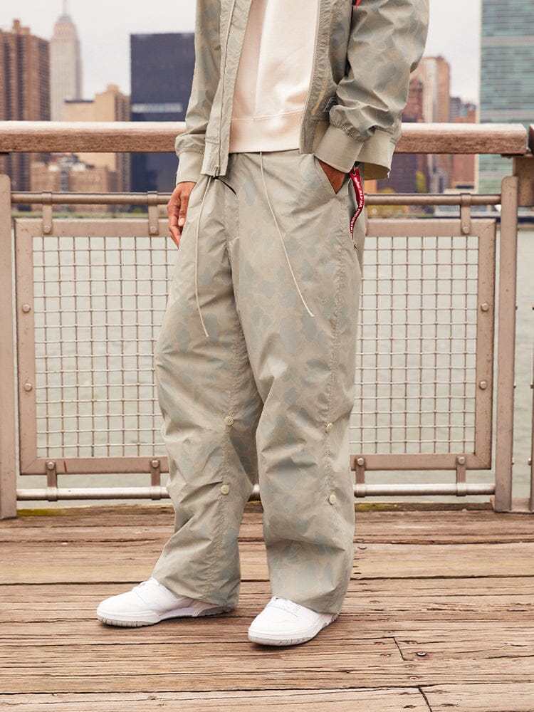 Alpha Industries Lightweight Parachute Pant Frogskin, parachute material, camouflage pattern, elastic waistband, drawstring closure.