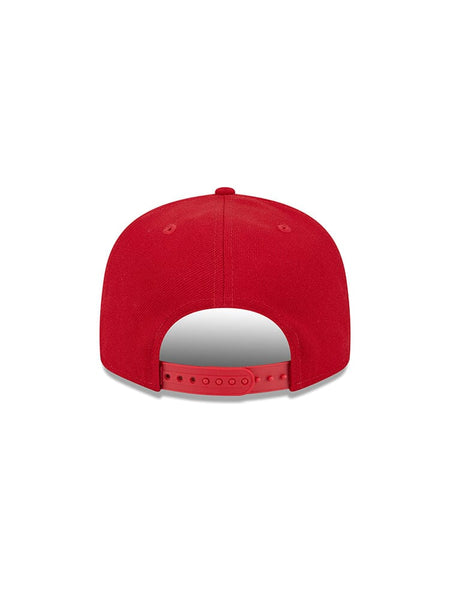 The San Francisco 49ers x Alpha x New Era 950 Cap, designed by Alpha Industries under model FW24-NE-NFL, showcases a bold team logo and features an adjustable strap. The red New Era snapback cap is stylishly depicted from the back.