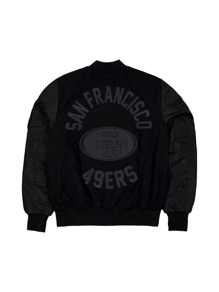 The San Francisco 49ers x Alpha x New Era Wool Varsity MA-1 Bomber Jacket by Alpha Industries features a large logo on the back, designed in black with a wool outer shell for warmth.