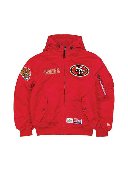 Experience the San Francisco 49ers X Alpha X New Era L-2B Bomber Jacket by Alpha Industries, showcasing San Francisco 49ers logos and team patches on the front and sleeves in a vibrant Speed Red color.