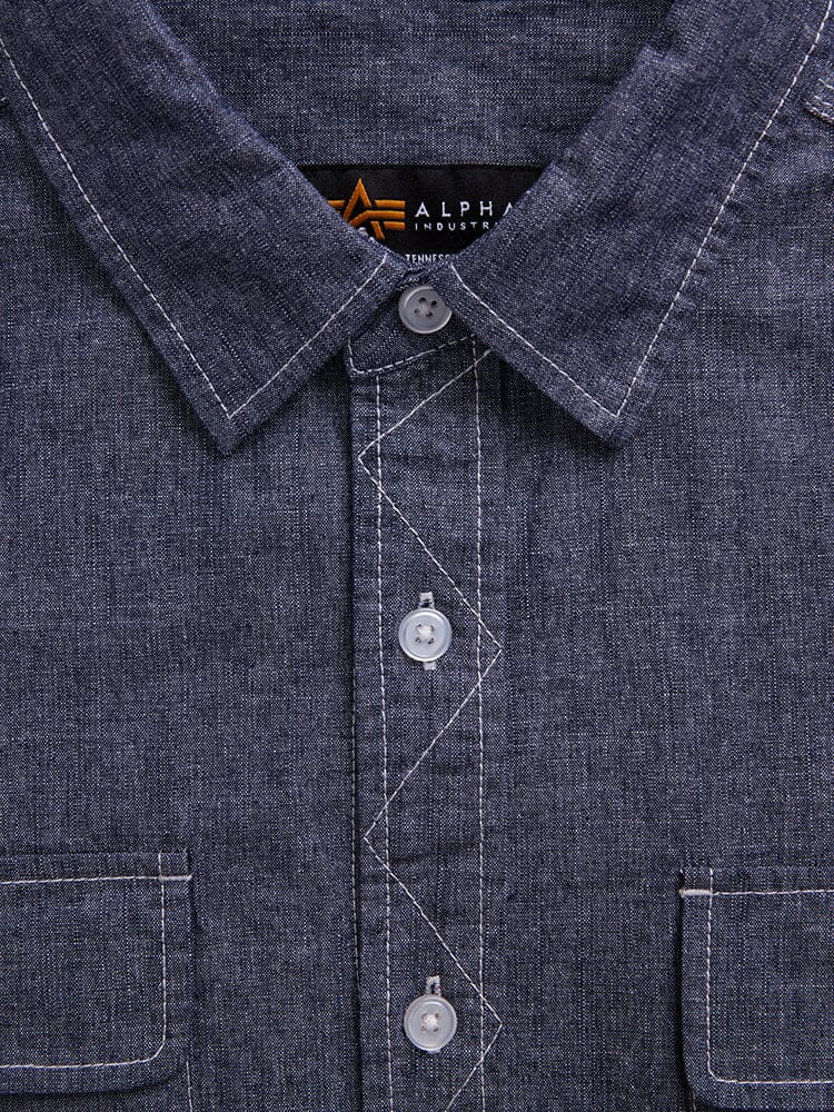 Alpha Industries Short Sleeve Multi Pocket Shirt, dark blue, white stitching, chest flap pockets, visible brand label inside collar.