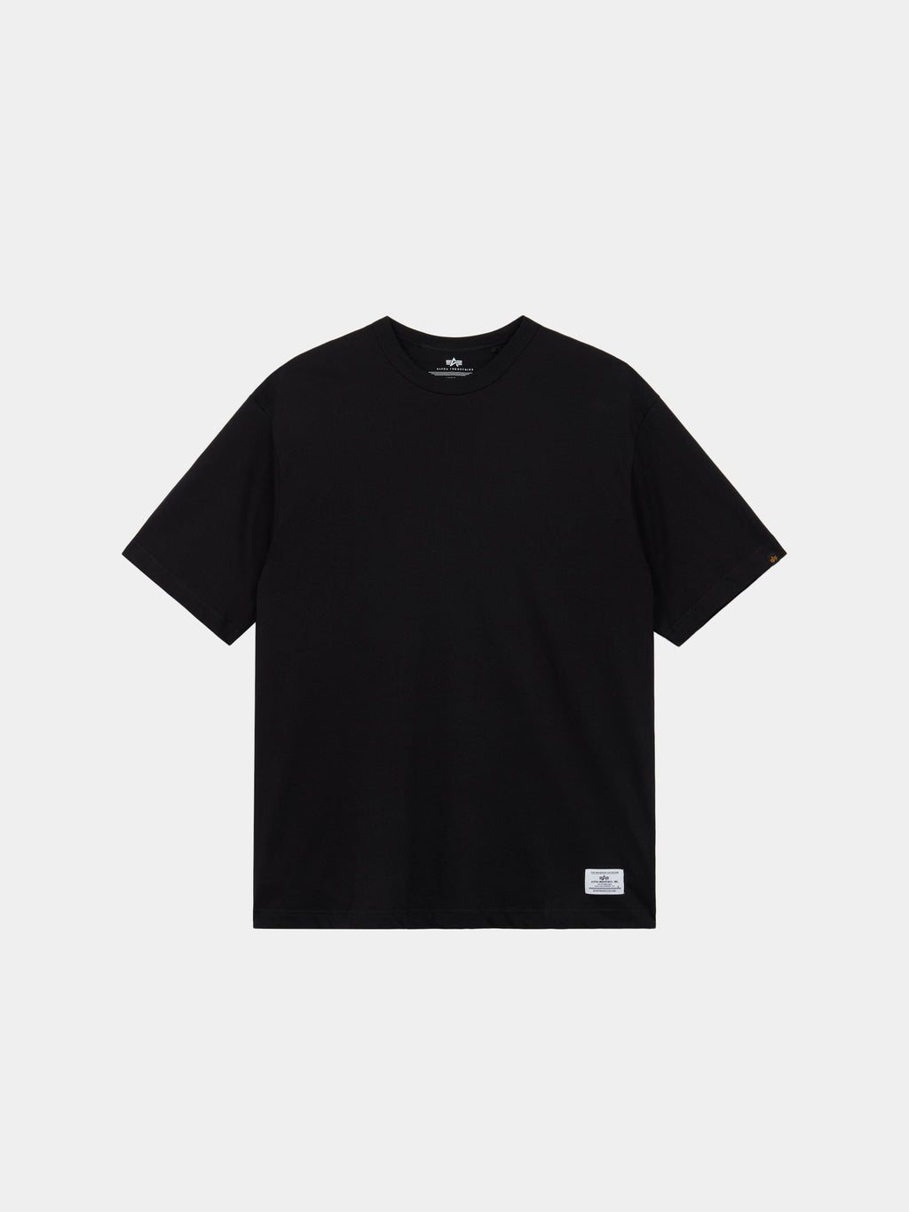 Alpha Industries Short Sleeve Relaxed Tee in black with crew neck, short sleeves, and small white label at the hem.