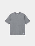 Alpha Industries Short Sleeve Relaxed Tee in Medium Charcoal Heather with a small white label near the bottom hem.