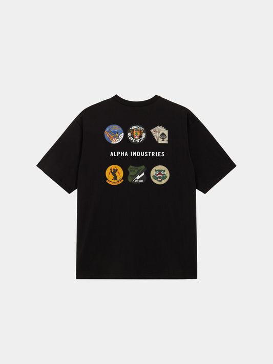 The Alpha Industries Short Sleeve Patched Tee in Black with six military-inspired patches and Alpha Industries branding on the back.